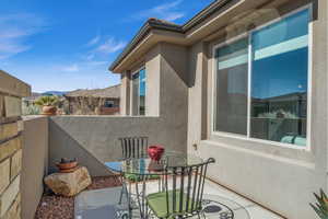 Balcony featuring outdoor dining area, a patio area, and a mountain view