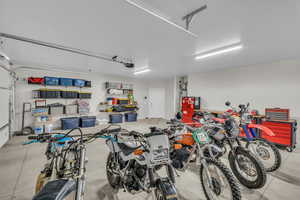 Garage featuring bike storage and a garage door opener