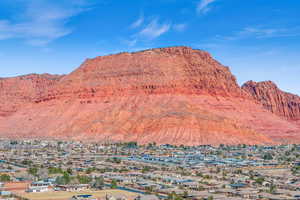 Property view of mountains with a residential view