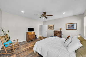 Bedroom with dark wood-style floors, baseboards, a ceiling fan, and recessed lighting