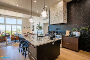 The open kitchen and living room concept with a dining area, and large windows that lead to the deck.