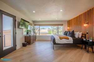 Master bedroom includes its own entrance to the balcony/deck, a massive walk in closet, and natural light.