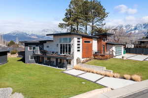 View of front of property featuring 2 driveways and mountain views.