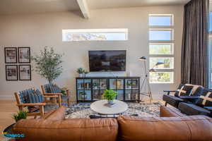 Natural light enters many ways into the living room and kitchen.