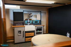 Details of the kids play kitchen below the loft bed.