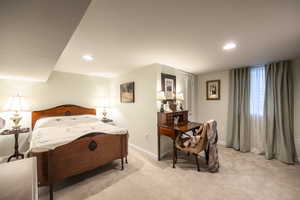 Bedroom with recessed lighting, baseboards, and light colored carpet