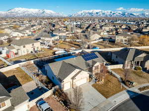 Birds eye view of property with a residential view and a mountain view