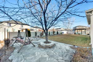 View of yard with a fenced backyard, a patio, and a pergola