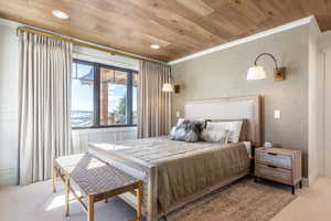 Bedroom with ornamental molding, recessed lighting, wooden ceiling, and light carpet