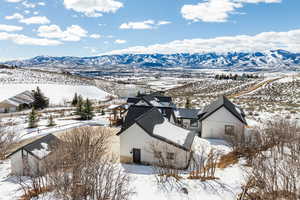 Snowy aerial view with a mountain view