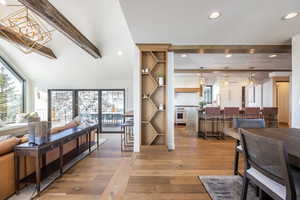 Interior space featuring light wood-type flooring, beam ceiling, and recessed lighting