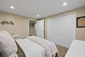 Bedroom featuring carpet floors, a closet, and recessed lighting