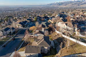 Birds eye view of property with a mountain view and a residential view