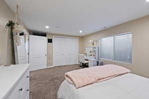 Bedroom with recessed lighting, carpet floors, visible vents, a closet, and radiator