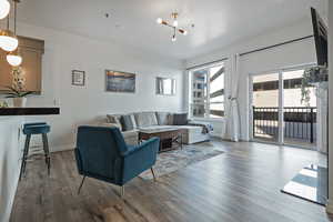 Living area featuring baseboards and wood finished floors