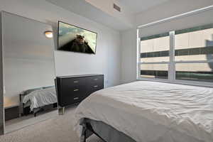 Bedroom featuring carpet flooring and visible vents