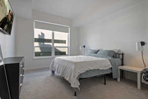 Carpeted bedroom with baseboards