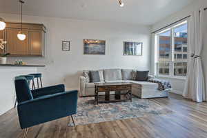 Living room with baseboards and wood finished floors