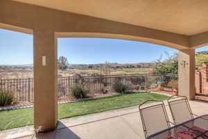 View of patio with a fenced backyard