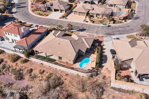 Birds eye view of property with a residential view