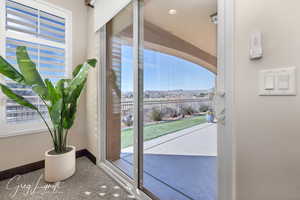 Spacious owners suite with sliding door to outside covered patio with a beautiful view