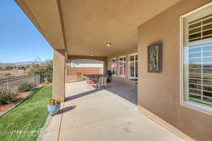 View of patio with a fenced backyard