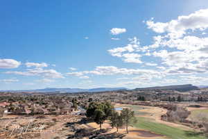 Property view of mountains with a  view of golf course