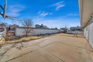 Exterior space featuring a patio and a fenced backyard