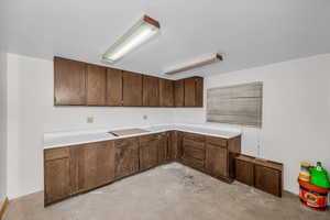 Kitchen featuring light countertops and unfinished concrete floors