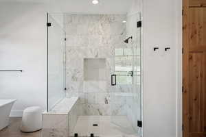 Full bath featuring a shower stall, recessed lighting, and a freestanding tub