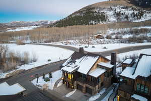 Snowy aerial view featuring a mountain view