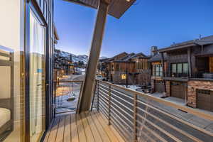 Balcony featuring a residential view and a mountain view