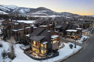 Snowy aerial view with a residential view and a mountain view