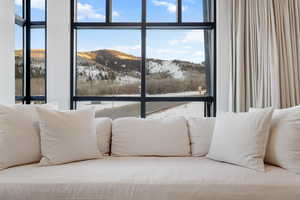 Interior space featuring expansive windows and a mountain view