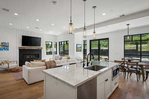 Kitchen featuring hardwood / wood-style flooring, recessed lighting, and plenty of natural light