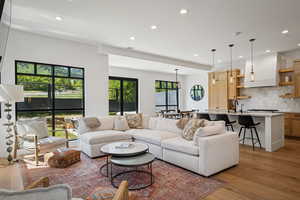Living room featuring recessed lighting and light wood-style flooring