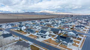 Birds eye view of property with a residential view and a mountain view