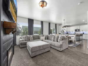 Living room with recessed lighting, plenty of natural light, and wood finished floors