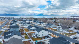 Birds eye view of property with a residential view and a water view