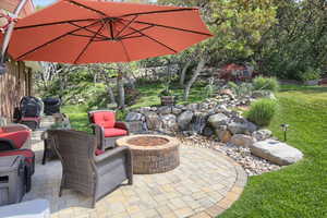 View of patio / terrace with an outdoor fire pit