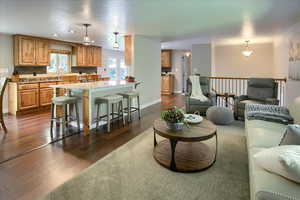 Living room with dark hardwood / wood-style floors