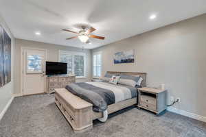 Bedroom with light carpet, ceiling fan, recessed lighting, and baseboards