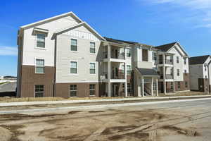 View of property with a residential view