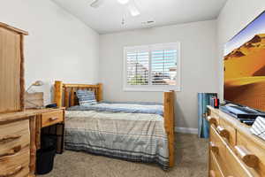 Carpeted bedroom featuring visible vents, ceiling fan, and baseboards