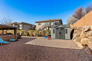 Exterior space with a shed, and fence