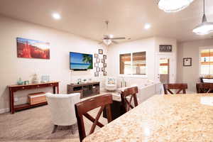 Living Room featuring a ceiling fan, recessed lighting, and carpet floors