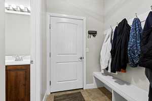 Mudroom with half bathroom