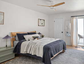 Bedroom featuring visible vents, ceiling fan, baseboards, and wood finished floors