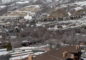 Snowy aerial view featuring a mountain view