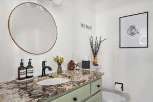 Bathroom with toilet and vanity